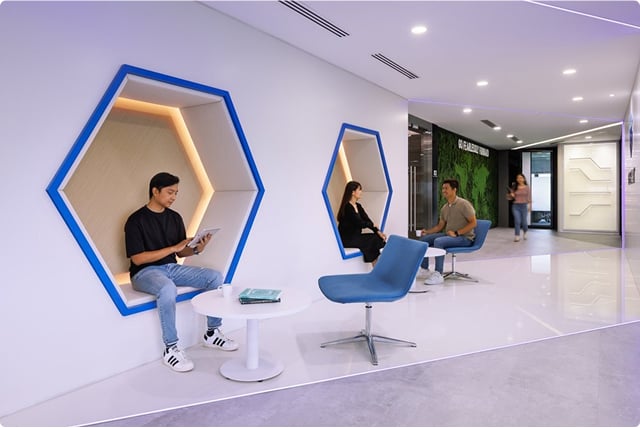 6fa3d026-f707-4743-bd64-de0a6169ba73 People using phone in a room