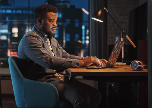 guy sitting with laptop