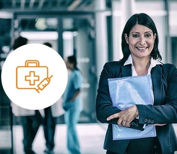 healthcare-cs-1 Professional woman in business attire holding documents, standing confidently in a healthcare setting with a medical icon overlay, symbolizing the intersection of business and healthcare management